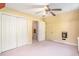 Bright bedroom featuring a built in fireplace and three closets for storage at 4920 Meadow St., Loris, SC 29569