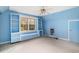 Blue bedroom featuring built-in shelving, a window seat and ample natural light at 4920 Meadow St., Loris, SC 29569