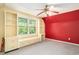 Cozy bedroom with built-in shelving and a window seat that provides ample sunlight at 4920 Meadow St., Loris, SC 29569