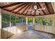 Enclosed gazebo with a wood ceiling, ceiling fan, many windows, and a view of the outdoors at 4920 Meadow St., Loris, SC 29569