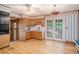 Kitchen featuring wood cabinets, double doors leading to the outside, and a ceiling fan at 4920 Meadow St., Loris, SC 29569