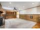 Spacious living room featuring wood paneling, built in shelves, carpet and wood flooring, and recessed lighting at 4920 Meadow St., Loris, SC 29569