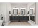 Modern bathroom featuring double sinks, dark cabinets, and modern light fixtures at 558 Oxbow Dr., Myrtle Beach, SC 29579