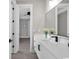 Bright bathroom featuring a long vanity with double sinks and sleek, modern fixtures at 558 Oxbow Dr., Myrtle Beach, SC 29579