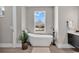 Elegant bathroom with a soaking tub near a window, and a modern faucet at 558 Oxbow Dr., Myrtle Beach, SC 29579
