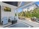 Covered patio featuring comfortable seating, an outdoor dining table, and a lush green lawn at 558 Oxbow Dr., Myrtle Beach, SC 29579