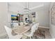Bright dining room featuring modern chandelier, seating for eight, and stylish decor at 558 Oxbow Dr., Myrtle Beach, SC 29579