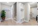 Bright entryway featuring a custom built-in storage unit, light wood flooring, and neutral walls at 558 Oxbow Dr., Myrtle Beach, SC 29579