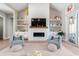Cozy living room boasts built-in shelving, decorative fireplace, modern lighting and comfortable seating at 558 Oxbow Dr., Myrtle Beach, SC 29579
