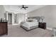 Spacious main bedroom features a trey ceiling, a large window, and an ensuite bathroom at 558 Oxbow Dr., Myrtle Beach, SC 29579