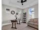 Office features hardwood floors, rustic wood desk, neutral decor, and natural light at 558 Oxbow Dr., Myrtle Beach, SC 29579