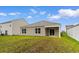 The backyard features a covered patio and a lawn at 572 Woodland Farms Circle, Aynor, SC 29511
