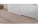 A bedroom featuring neutral carpet, a door, and white walls at 572 Woodland Farms Circle, Aynor, SC 29511