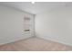 An empty bedroom with neutral walls and carpets, and a window with blinds at 572 Woodland Farms Circle, Aynor, SC 29511