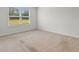 Bedroom with window allowing for natural light with neutral walls and carpet at 572 Woodland Farms Circle, Aynor, SC 29511