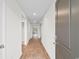 Bright hallway featuring sleek wood-look flooring and access to various rooms at 572 Woodland Farms Circle, Aynor, SC 29511