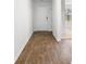 Hallway with hard surface floors and contrasting white trim and walls at 572 Woodland Farms Circle, Aynor, SC 29511