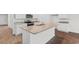 Bright kitchen with granite countertops, stainless steel appliances, and hardwood flooring at 572 Woodland Farms Circle, Aynor, SC 29511