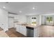 Bright kitchen featuring stainless appliances, a kitchen island with sink, and an open floor plan at 572 Woodland Farms Circle, Aynor, SC 29511