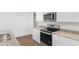 Close up of kitchen featuring stainless appliances, granite countertops, and white cabinets at 572 Woodland Farms Circle, Aynor, SC 29511