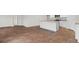 Open-concept living room features hardwood flooring and an island with seating at 572 Woodland Farms Circle, Aynor, SC 29511