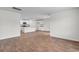 Spacious open living room with hardwood floors flowing into the kitchen area at 572 Woodland Farms Circle, Aynor, SC 29511