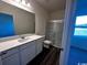 Modern bathroom features a sleek vanity with countertop sink, walk-in shower with glass door, and luxury flooring at 594 Castillo Dr., Loris, SC 29569