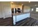 Well-equipped kitchen featuring granite countertops, stainless steel appliances, white cabinets and an island at 594 Castillo Dr., Loris, SC 29569