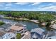 Scenic aerial view of canal-front homes with lush green trees and waterfront access at 6001 - Mh 17A South Kings Hwy., Myrtle Beach, SC 29575