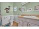 Bathroom with a single sink vanity, granite countertops, framed mirror and a shower and toilet at 6001 - Mh 17A South Kings Hwy., Myrtle Beach, SC 29575