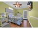 Cozy bedroom with light green walls and ceiling fan at 6001 - Mh 17A South Kings Hwy., Myrtle Beach, SC 29575