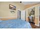Coastal bedroom with a TV, workstation, and bed decorated with seashell patterns, creating a relaxing retreat at 6001 - Mh 17A South Kings Hwy., Myrtle Beach, SC 29575