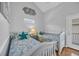 Comfortable bedroom featuring two twin beds with seaside themed bedding, perfect for guests or children at 6001 - Mh 17A South Kings Hwy., Myrtle Beach, SC 29575