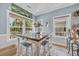 Dining area with tile floors, large windows, and natural light at 6001 - Mh 17A South Kings Hwy., Myrtle Beach, SC 29575