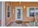 Close up of a charming front door with a teal door and light fixture at 6001 - Mh 17A South Kings Hwy., Myrtle Beach, SC 29575