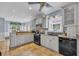 Well-lit kitchen featuring granite countertops, tile backsplash, and black appliances at 6001 - Mh 17A South Kings Hwy., Myrtle Beach, SC 29575