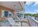 Large porch with lounge chairs and views of the water and neighborhood at 6001 - Mh 17A South Kings Hwy., Myrtle Beach, SC 29575