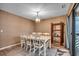 Charming dining room featuring a table for six, stylish light fixture, and views of the ocean at 618 N Waccamaw Dr. # B7, Garden City Beach, SC 29576