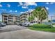 Building exterior showing complex name with multiple parking spots and palm trees at 618 N Waccamaw Dr. # B7, Garden City Beach, SC 29576
