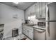 Efficient kitchen with stainless steel appliances and granite countertops at 618 N Waccamaw Dr. # B7, Garden City Beach, SC 29576