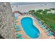Aerial view of the community pool, surrounded by lounge chairs with access to the beach and ocean at 618 N Waccamaw Dr. # B7, Garden City Beach, SC 29576