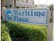 Entrance sign for 'Maritime Place' with lush greenery and well-maintained landscaping at 618 N Waccamaw Dr. # B7, Garden City Beach, SC 29576