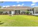 Expansive backyard with a covered patio and lush green grass, great for outdoor activities at 637 Botany Loop # 64, Murrells Inlet, SC 29576