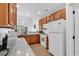 Bright kitchen featuring wooden cabinetry, ample countertop space, and modern appliances at 637 Botany Loop # 64, Murrells Inlet, SC 29576