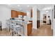 Well-lit kitchen with a breakfast bar, stainless steel appliances, and laminate floors at 637 Botany Loop # 64, Murrells Inlet, SC 29576