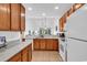 Open kitchen design with marble countertops and wooden cabinetry at 637 Botany Loop # 64, Murrells Inlet, SC 29576