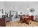 Spacious living room with hardwood floors, ceiling fan and large windows at 637 Botany Loop # 64, Murrells Inlet, SC 29576