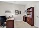 Functional office space features a work desk, bookcase, and neutral carpeting at 637 Botany Loop # 64, Murrells Inlet, SC 29576