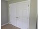 View of a large white closet with gold knobs, and beige carpet at 6542 Wellington Dr., Murrells Inlet, SC 29576