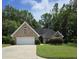 Charming brick home with a well-manicured lawn and mature trees in a serene setting at 6542 Wellington Dr., Murrells Inlet, SC 29576
